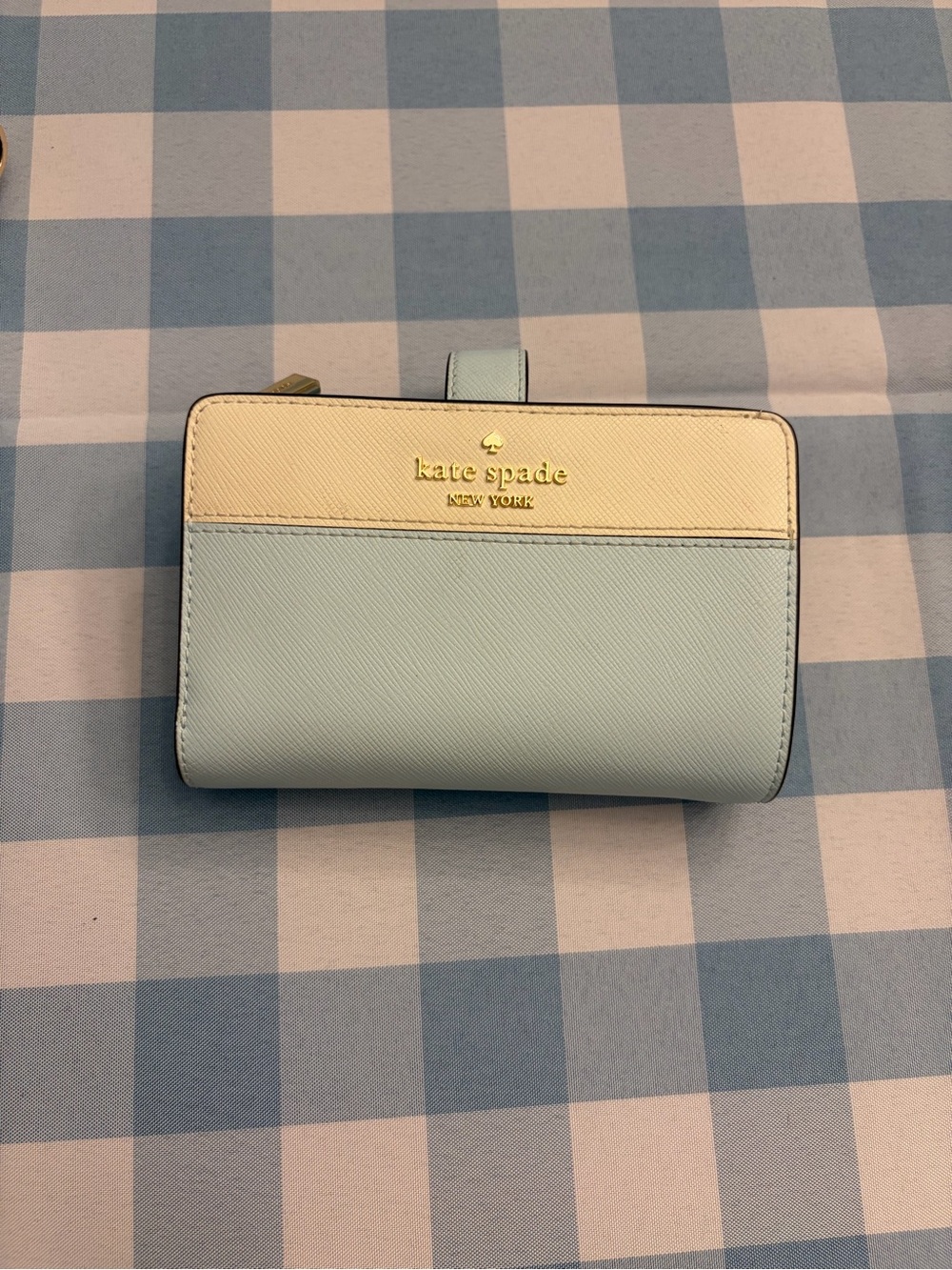 kate spade two-tone cream and light blue small wallet with gold logo